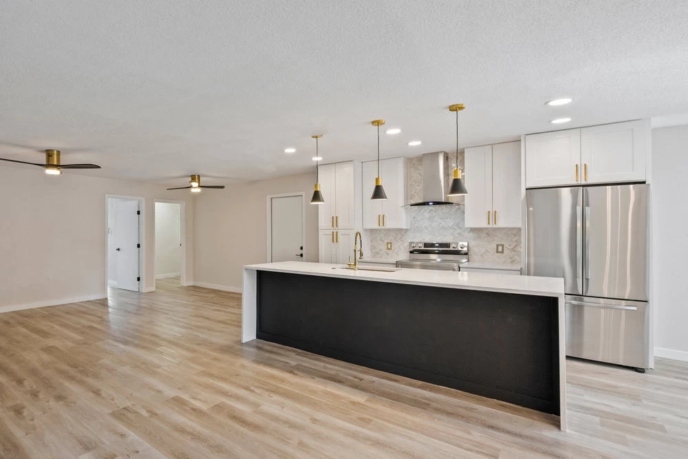 A clean kitchen with white cabinets and wood floors in Contra Costa County, CA.