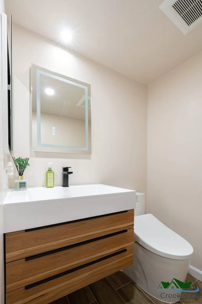 A shower with a glass door and shelves in Contra Costa County, CA.