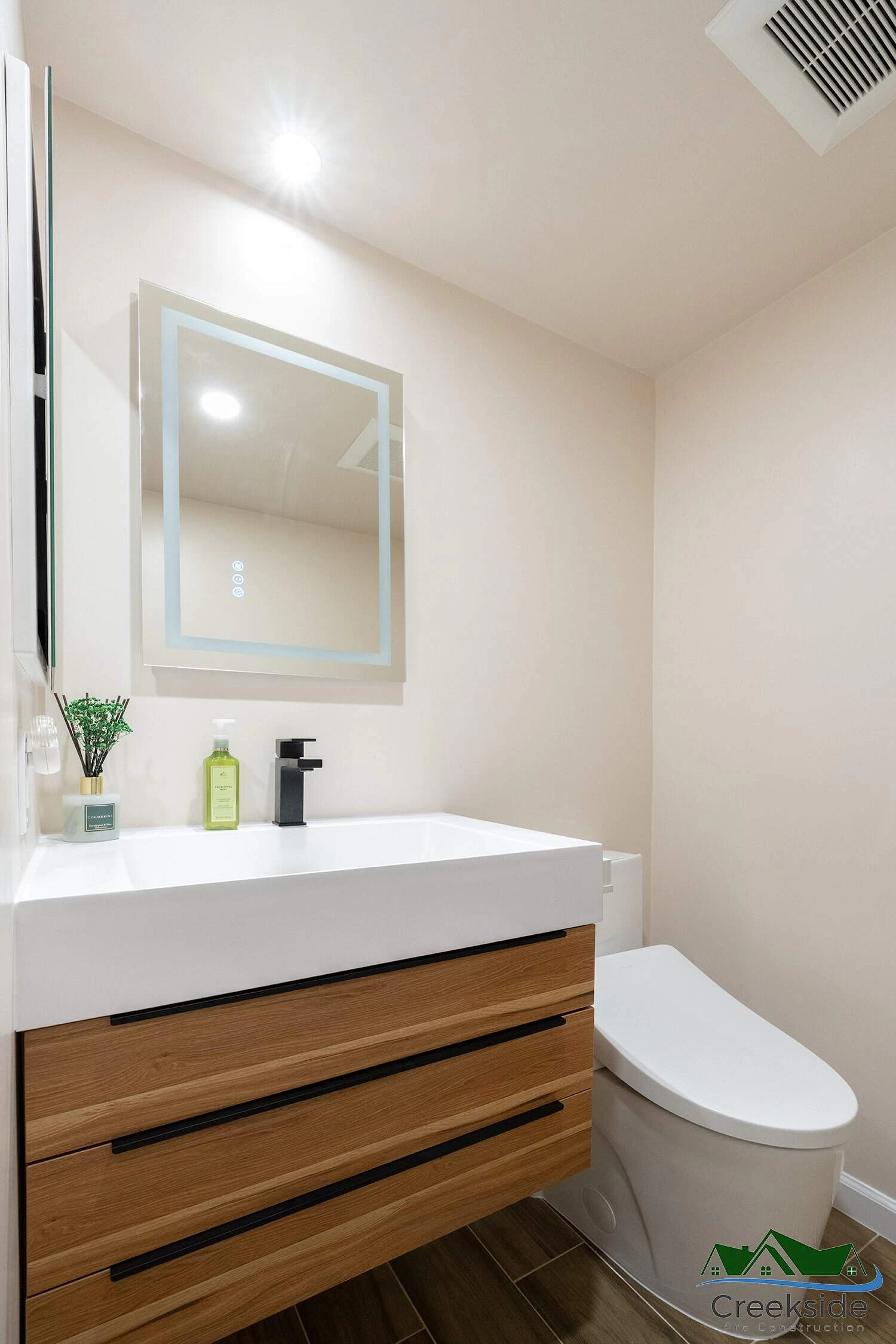 A shower with a glass door and shelves in Contra Costa County, CA.