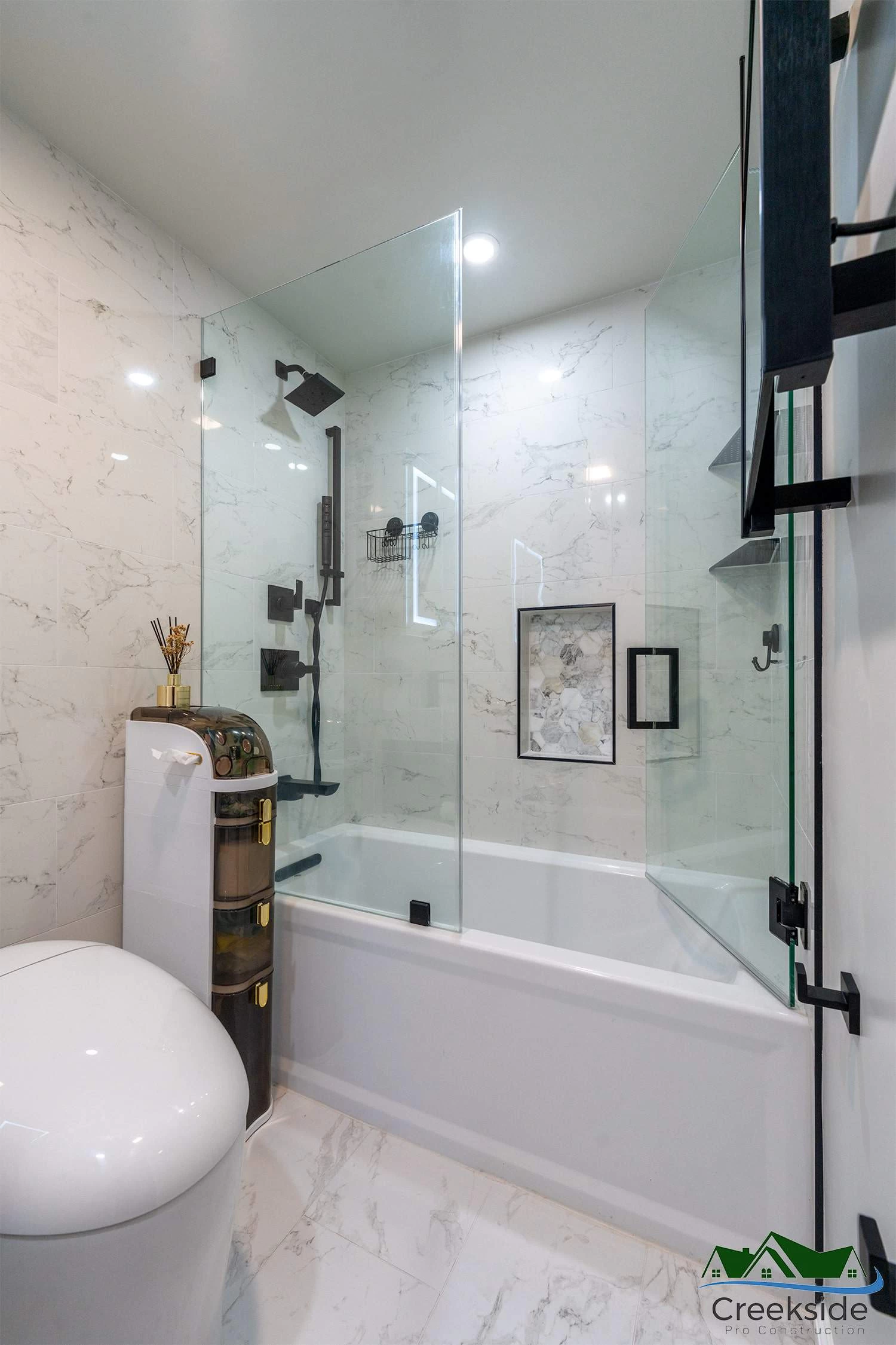 A bathroom with a toilet, sink and mirror in Contra Costa County, CA.