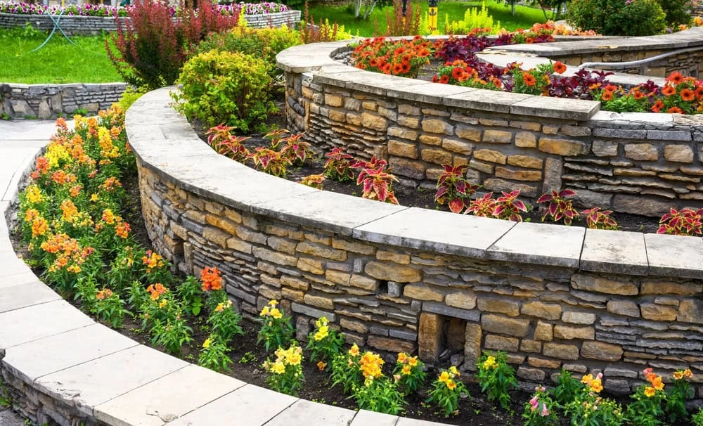 Home remodeling with landscaping, retaining walls, and flowerbeds in Contra Costa County backyard